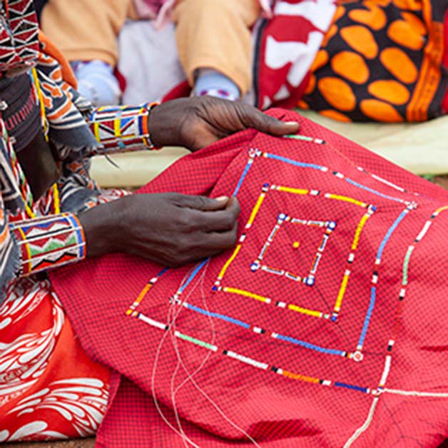 Woman sewing African textile
